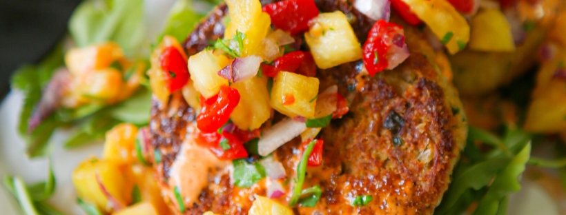Plated crab cakes with roasted red pepper and pineapple salsa | appetizer | gluten-free | filler free | pescatarian | fish and seafood dish